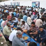A large number of people break their fast during Free Iftar at the roadside in the Saddar area of the city during the holy fasting month of Ramazan.