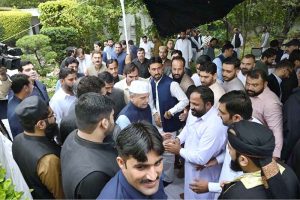 Prime Minister Muhammad Shehbaz Sharif exchanging Eid greetings with people after offering Eid ul Fitr prayers