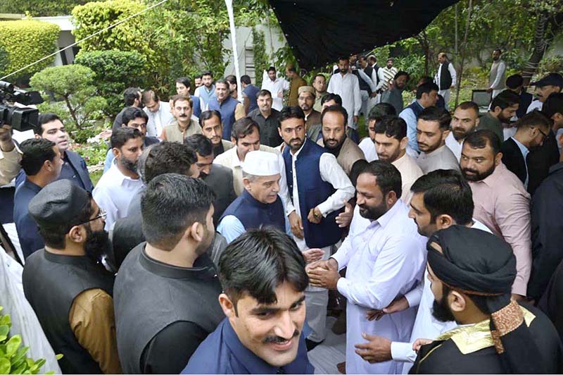 Prime Minister Muhammad Shehbaz Sharif exchanging Eid greetings with people after offering Eid ul Fitr prayers