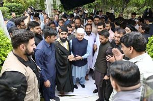 Prime Minister Muhammad Shehbaz Sharif exchanging Eid greetings with people after offering Eid ul Fitr prayers