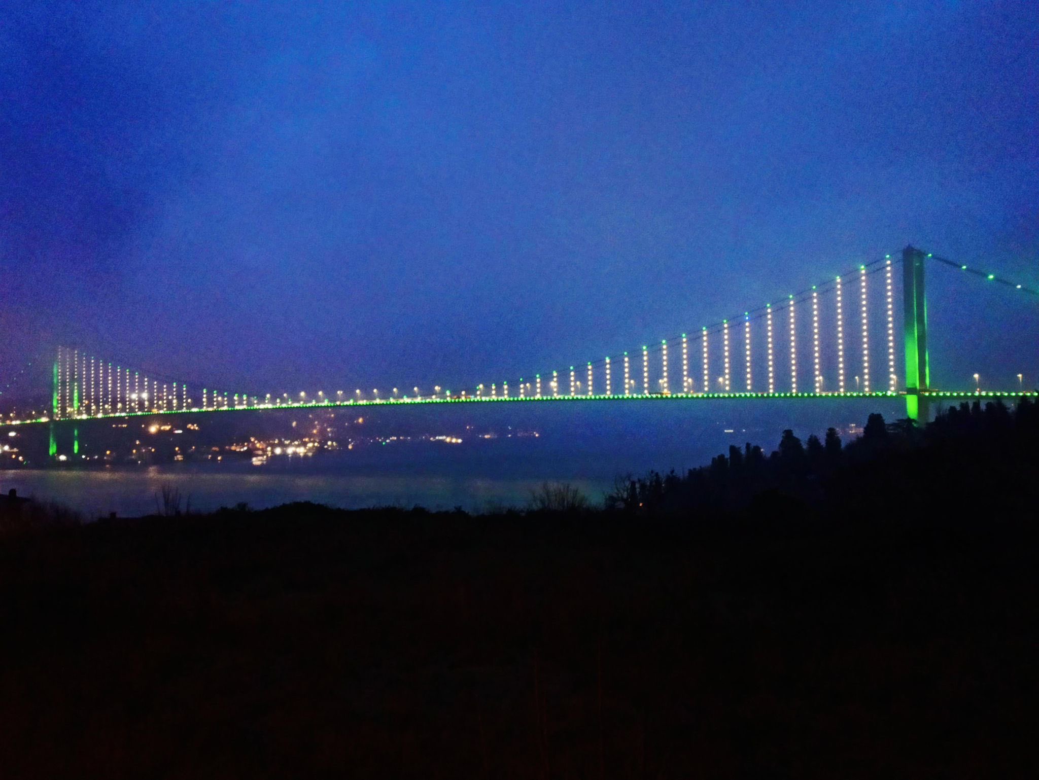 World landmarks illuminate in Pakistan flag colors on Pakistan Day