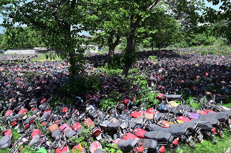 A large number of motorcycles recovered by police are parked outside a police station in the Federal Capital. The motorcycles had earlier been impounded at various police stations and special checking points during document verification drives
