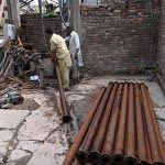 WASA workers busy repairing a local tube well at Pindora Benazir Chowk near Saidpur Road