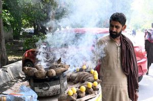 A vendor selling traditional summer drink at his roadside setup in the Provincial Capital
