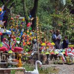 A display of colorful garden ornaments and birdhouses brightens a roadside stall in the federal capital