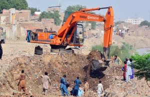 A view of construction work on a road with heavy machinery outside Pinyari Canal during ongoing development work in the city.
