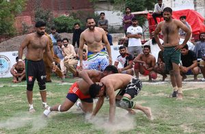 Players in action during a kabaddi match between Sargodha and Bhakkar at the Chief Minister Punjab Inter-District Kabaddi Championship.