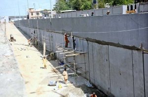 Labourers are busy at work on the Kutchery Chowk remodeling project during development work in the city.