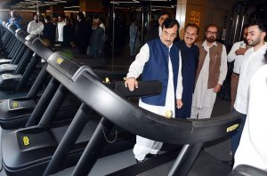 Chairman Senate Syed Yousaf Raza Gilani inspects fitness machines at the Energized Fitness Pavilion.