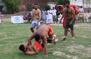 Players in action during a kabaddi match between Sargodha and Bhakkar at the Chief Minister Punjab Inter-District Kabaddi Championship.