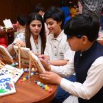 Students are busy in painting during the Exclusive Preview of Sapphire International School