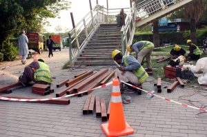 Labourers are busy repairing and working on the construction of the Ferozepur Road Metro Station
