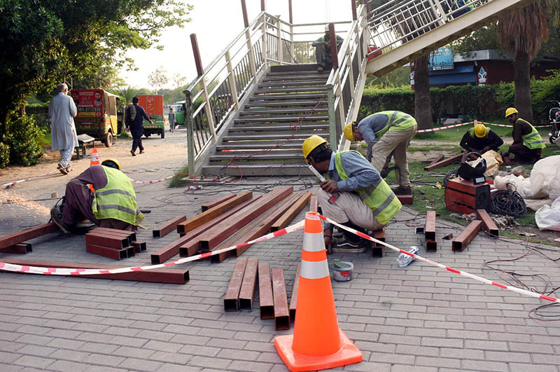 Labourers are busy repairing and working on the construction of the Ferozepur Road Metro Station