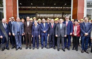 President Asif Ali Zardari in a group photograph with workers during his visit to SANY Heavy Industry Co., Ltd