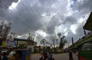 A mesmerizing view of thick black clouds hovering over the skies signaling rain at Bomb Chowk.