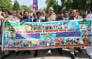 Provincial Ombudsman Sindh Regional Director Larkana Ali Akbar Jagirani, along with Director Schools Education (ES&HS) Prof. Allah Bux Soomro and others, lead a district-level Enrollment and Retention Drive rally in front of the Press Club.