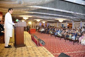 Acting President Syed Yousaf Raza Gilani addressing the Old Ravians Association's annual dinner held at a local hotel