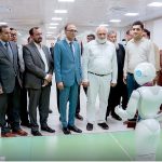 Chairman Higher Education Commission (HEC) Prof. Dr. Niaz Ahmed Akhtar observes the functions of humanoid robots during his visit to IBA University, Sukkur