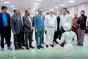 Chairman Higher Education Commission (HEC) Prof. Dr. Niaz Ahmed Akhtar observes the functions of humanoid robots during his visit to IBA University, Sukkur