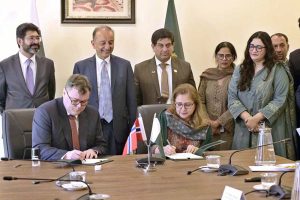 Ms. Aisha Humera, Secretary M/O Climate Change & Environmental Coordination and Norwegian Ambassador to Pakistan H.E. Per Albert Ilsaas signing MoU between Pakistan and Norway. Federal Minister for Climate Change and Environmental Coordination, Dr. Musadik Malik also present on the occasion