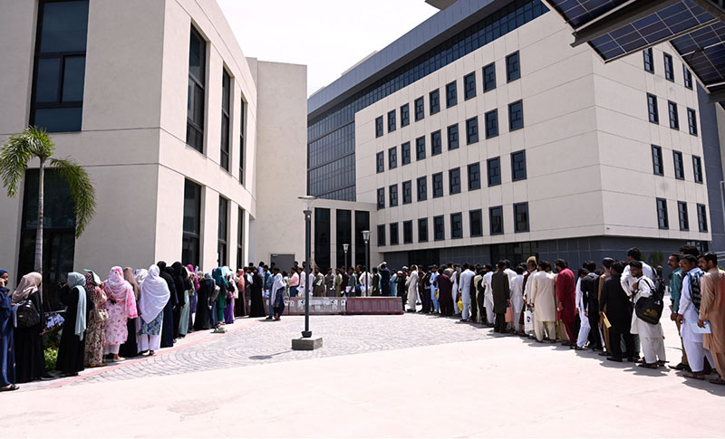 Candidates are standing in queues to submit documents for various job opportunities at the Main Nawaz Sharif Cardiology Center