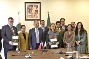 Ms. Aisha Humera, Secretary M/O Climate Change & Environmental Coordination and Norwegian Ambassador to Pakistan H.E. Per Albert Ilsaas signing MoU between Pakistan and Norway. Federal Minister for Climate Change and Environmental Coordination, Dr. Musadik Malik also present on the occasion