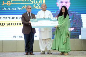 Prime Minister Muhammad Shehbaz Sharif distributes PM Apna Ghar Program cheques among the beneficiaries.
