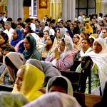 Worshipers attend Good Friday service at the Sacred Heart Cathedral Church