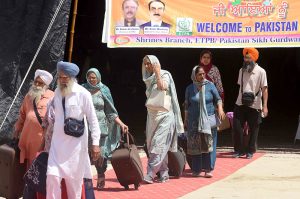 Thousands of Indian Sikh pilgrims (yatrees) arrive at Wagah Border to attend the Vaisakhi Mela and celebrate the 327th birth anniversary of the Khalsa
