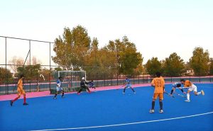 CEO Fieaura Malik Mohammad Hassan, senior hockey player Manzoor Hayder, and organizer Hassan Haider Shah distribute prizes to the winners during the closing ceremony of the Hockey Festival organized by Crescent Hockey Club and Fatima Women Hockey Academy at Austro Turf Hockey Stadium.