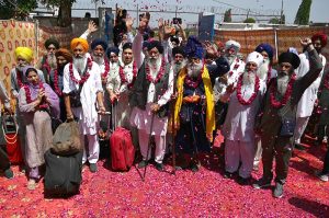 Thousands of Indian Sikh pilgrims (yatrees) arrive at Wagah Border to attend the Vaisakhi Mela and celebrate the 327th birth anniversary of the Khalsa