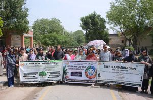 Vice Chancellor Government College Women University Faisalabad (GCWUF) Dr. Kanwal Ameen leads an awareness walk organized by the Department of Botany in collaboration with Green & Clean Society to mark Earth Day.
