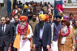 Thousands of Indian Sikh pilgrims (yatrees) arrive at Wagah Border to attend the Vaisakhi Mela and celebrate the 327th birth anniversary of the Khalsa