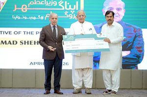 Prime Minister Muhammad Shehbaz Sharif distributes PM Apna Ghar Program cheques among the beneficiaries.