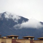 Clouds hovering on the surrounding mountains after a spell of heavy rain in the city