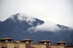Clouds hovering on the surrounding mountains after a spell of heavy rain in the city