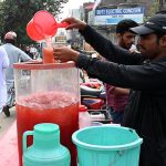 A Street vendor sells traditional drink on the roadside