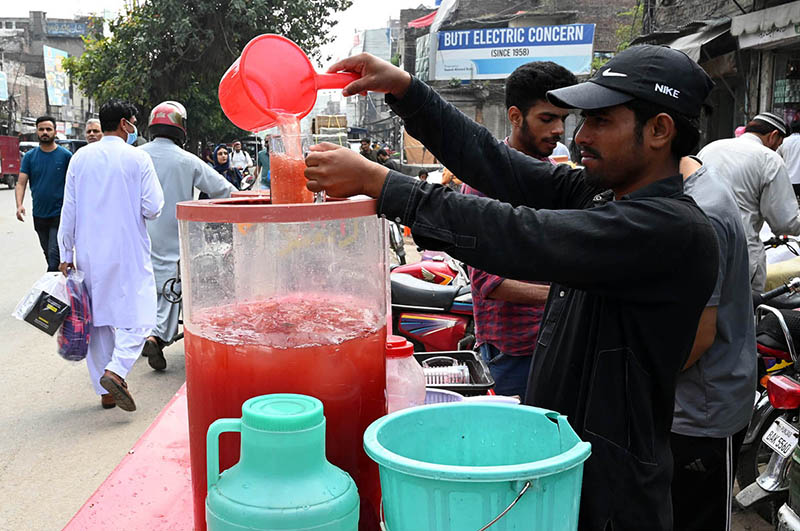 A Street vendor sells traditional drink on the roadside
