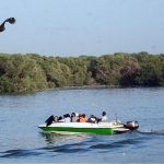 People enjoy boat ride near Native Jetty along the Arabian Sea