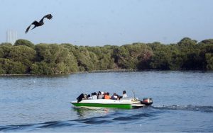 People enjoy boat ride near Native Jetty along the Arabian Sea