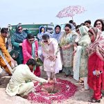 Vice Chancellor (VC) Government College Women University Faisalabad (GCWUF) Prof. Dr Kanwal Ameen is planting a sapling to inaugurate “Tree Plantation Drive” at Government College Women University Faisalabad (GCWUF) new campus