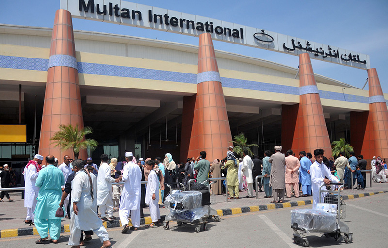 Relatives gathered outside Multan International Airport to see off Hajj pilgrims on the first Hajj flight