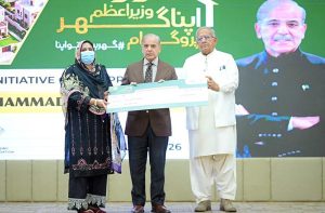 Prime Minister Muhammad Shehbaz Sharif distributes PM Apna Ghar Program cheques among the beneficiaries.