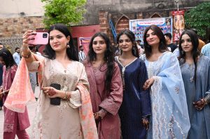 A large number of Christian faithful gather outside Don Bosco Church to take part in Easter celebrations.