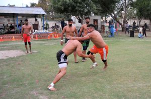 Players in action during Pakistan Railway Multan Division Kabaddi Exhibition Match playing between Multan Division and Lahore Division at Railway Ground.