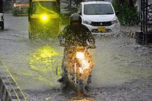 Commuters facing heavy rain in the city