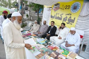 People visiting a book stall during Kitab Mela on the eve of International Book Day organized by Tehreek Mehnat.