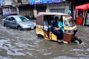 Commuters facing heavy rain in the city