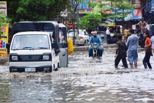 Commuters facing heavy rain in the city