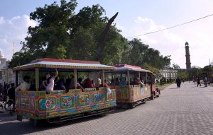 People enjoying a tram ride at Greater Iqbal Park